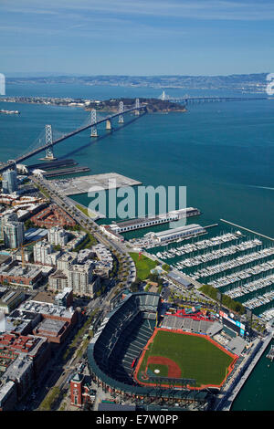 AT&T Park / Giants Ballpark, South Beach Marina, downtown San Francisco, and Bay Bridge, California, USA - aerial Stock Photo