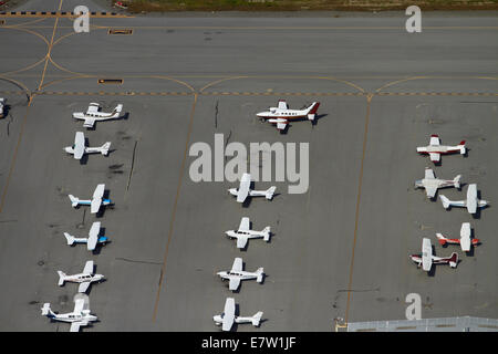 Light planes parked at San Carlos Airport, San Francisco, California, USA - aerial Stock Photo
