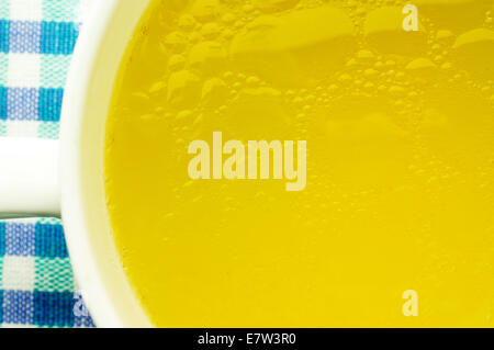 Fat oily broth, bouillon, clear soup close-up Stock Photo