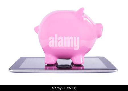 Pink piggy bank on tablet with blank screen, isolated on white background. Stock Photo