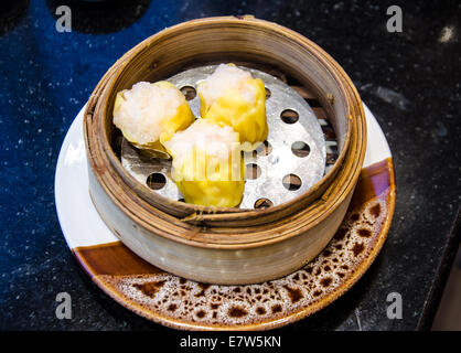 various Dim Sum in Bamboo Steamed Bowl Stock Photo