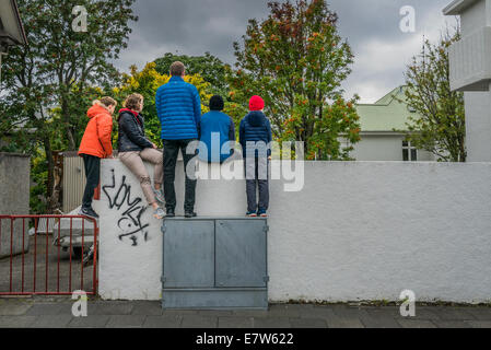 Family watching a small performance during a Summer Festival, Cultural Night, Reykjavik, Iceland Stock Photo