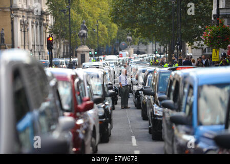 Whitehall, London, UK. 24th September 2014. Black cab drivers cause gridlock on Whitehall as they stage a protest against TFL. Credit:  Matthew Chattle/Alamy Live News Stock Photo