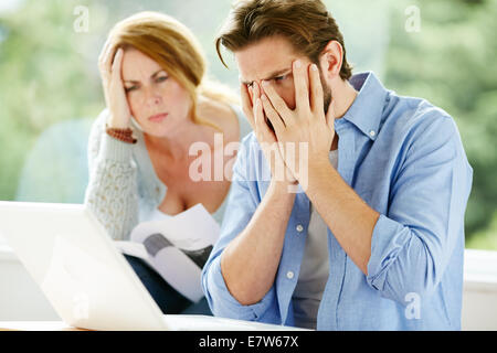 Couple working out finances Stock Photo