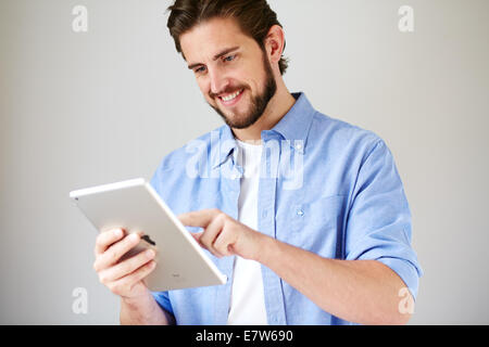Portrait of man using an iPad Stock Photo