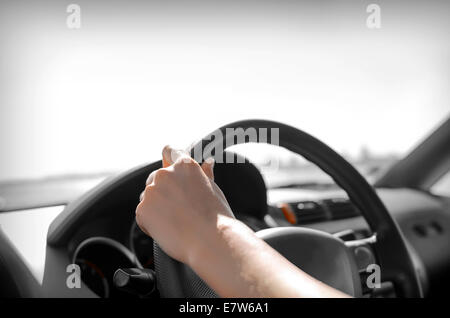 Driver rrive a car. Hands holding the wheel. Stock Photo