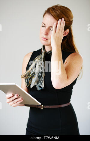Woman with headache Stock Photo