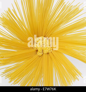 lots of radiant spaghetti and some ruotine noodles in light grey back Stock Photo