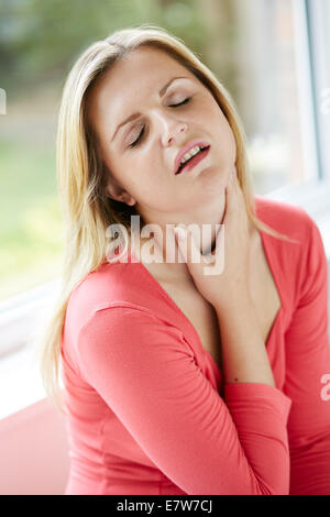 Woman with sore throat Stock Photo