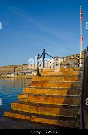 Early morning sun on the Mayflower Steps in Plymouth, Devon. Stock Photo