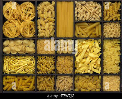 lots of various noodles in a wooden box Stock Photo