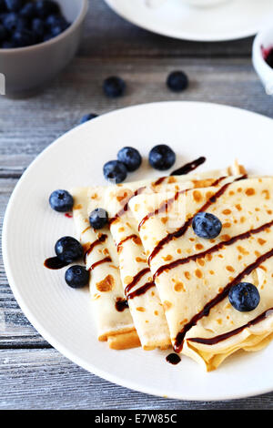 pancakes with chocolate sauce, side view Stock Photo