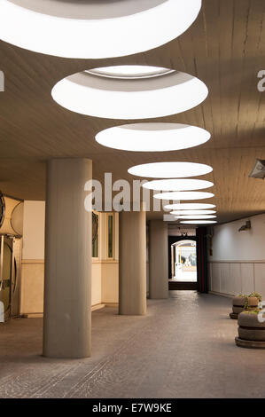 Circular windows in the ceiling of a modern office building Stock Photo