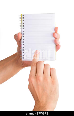 Hands holding and showing white, blank notebook, isolated on white background. Stock Photo
