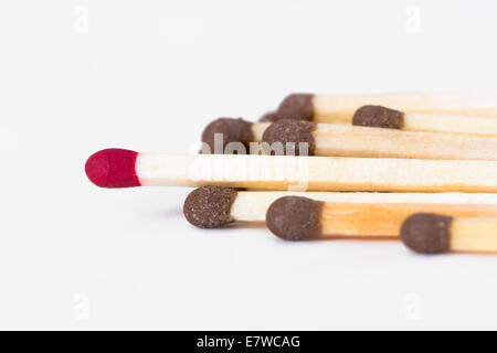 Business concept, red headed in front of others, standing out concept, isolated on white background. Stock Photo