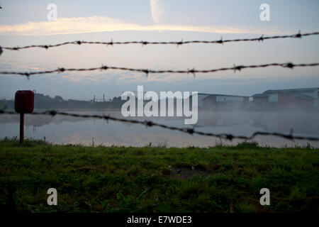 Empty gasometer and water reservoir Stock Photo - Alamy