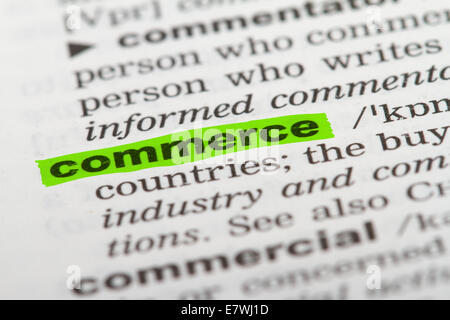 Commerce word highlighted with green marker on dictionary page. Stock Photo