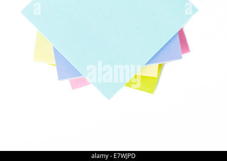 Stack of multi colored sticky post it notes with space, isolated on white background. Stock Photo