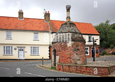 A view of the old Pump house in Common Place, Little Walsingham, Norfolk, England, United Kingdom. Stock Photo