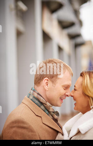 Portrait of amorous man and woman laughing outside Stock Photo