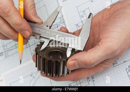 technical drawing and tools in hand Stock Photo