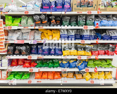 Packets of crisps on sale on the shelves of a UK supermarket Stock Photo