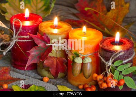Autumn candles with leaves vintage abstract still life in night Stock Photo