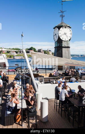 Outdoor bar restaurant at Aker Brygge pier in Oslo, Norway Stock Photo