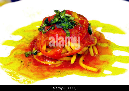 Italian spaghetti in tomato sauce with tomatoes and basil Stock Photo