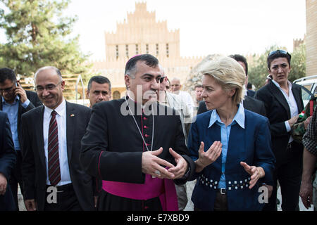 Erbil, Iraq. 25th Sep, 2014. German Minister of Defence Ursula von der Leyen (CDU, 2-R) talks to Chaldean archbishop Bashar Warda (C) at St. Joseph's Church in Ankawa near Erbil, Iraq, 25 September 2014. Von der Leyen made an unannounced trip to Iraq and assured Kurds in the North of the lasting solidarity for their fight against the Islamist terror militia Islamic State (IS). Photo: Maja Hitij/dpa/Alamy Live News Stock Photo