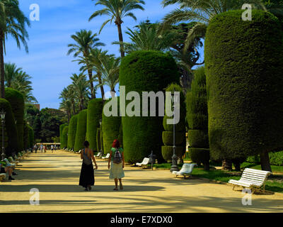 Two women walking in Genoves Park in Cadiz Stock Photo