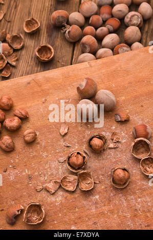 Organic cracked hazelnuts on a wooden board Stock Photo