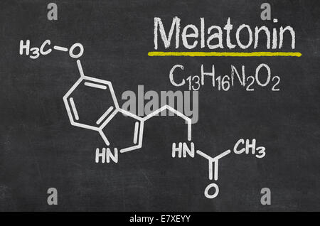 Blackboard with the chemical formula of melatonin Stock Photo