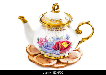 Beautiful photo of Ceramic teapot on Wooden stand . Stock Photo