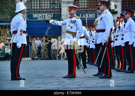 Casemates Square, Gibraltar. 25th September, 2014.  An annual military parade replicating the past tradition of the Ceremony of the Keys was held at Casemates Square, Gibraltar. Govornor Sir Dutton presided over the events in which the Royal Gibraltar Regiment enacted a ceremony dating back to the early British colonia period in Gibraltar when the city gates were closed every night. Credit:  Stephen Ignacio/Alamy Live News Stock Photo