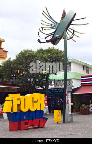 Foch yeah sign and a sculpture located on Plaza Foch, the center of the tourist district La Mariscal in Quito, Ecuador Stock Photo