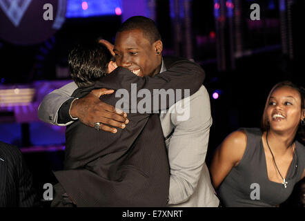 Miami Beach, FL, USA. 22nd Apr, 2010. Florida, USA - United States - (transmit) FL-pierre-paul-draft-0423a -- Jason Pierre-Paul hugs Drew Rosenhous after the New York Giants select him as the 15th overall pick in the 2010 NFL Draft, Thursday night, April 22, 2010. Pierre Paul watched the draft from the Fountainbleau Hotel, in Miami Beach. Michael Laughlin, Sun Sentinel © Sun-Sentinel/ZUMA Wire/Alamy Live News Stock Photo