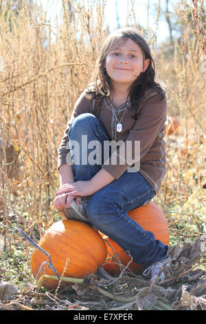 Young girl enjoying the harvest season Stock Photo