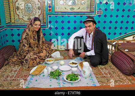 Iranian wedding couple having lunch in a traditional restaurant, Bazaar, Isfahan, Isfahan Province, Persia, Iran Stock Photo