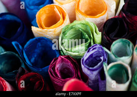 Rolls of colorful tissue paper outside an art supply shop. Stock Photo