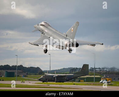 Eurofighter of No1 Sqn returning to RAF Lossiemouth with German Transal aircraft in background.  SCO 9135 Stock Photo