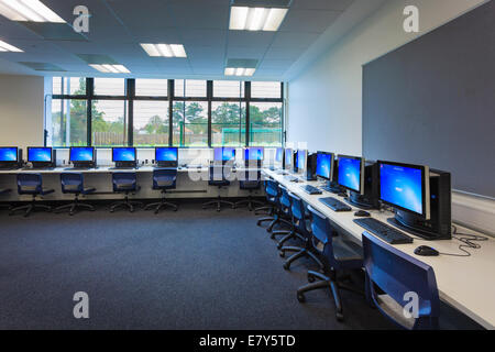 Computer screens around the walls of the computer room of Teddington Sixth Form College. Stock Photo