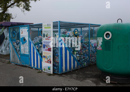 Recycling containers in a Car Park in the town of Plouescat, Brittany, France Stock Photo