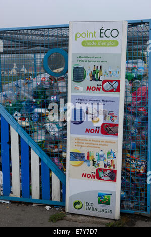 Recycling containers in a Car Park in the town of Plouescat, Brittany, France Stock Photo