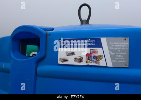 Recycling containers in a Car Park in the town of Plouescat, Brittany, France Stock Photo