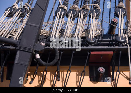 Portsmouth Historic Dockyard UK 02 April 2013: HMS Victory, close up on the anchor, rigging and one cannon porthole Stock Photo