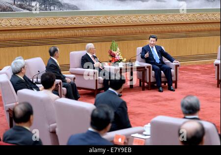 Beijing, China. 26th Sep, 2014. Xi Jinping (1st R rear), general secretary of the Communist Party of China Central Committee, meets with a Taiwanese delegation of pro-reunification groups at the Great Hall of the People in Beijing, capital of China, Sept. 26, 2014. © Li Tao/Xinhua/Alamy Live News Stock Photo