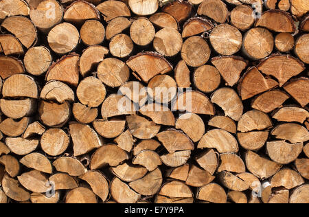 Stacked logs of spruce Stock Photo