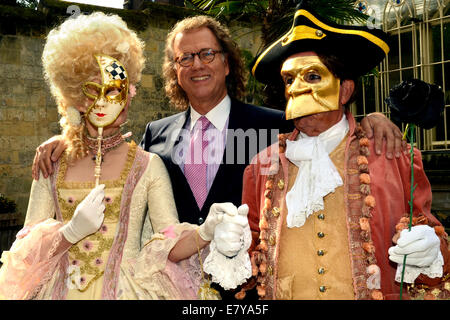 Andre Rieu and performers in Venetian costumes pose in the inner courtyard of his castle in Maastricht, The Netherlands, 25 September 2014. The Dutch violinist and his Johannes Strauss Orchestra played excerpts from his album 'Eine Nacht in Venedig' (lit. One night in Venice) in front of international members of the press for the first time. The album will be released on 31 October 2014. Afterwards a reception was held in the castle. Rieu will celebrate his 65th birthday on 01 October and start his tour through Germany in January 2015. Photo: HORST OSSINGER/dpa Stock Photo