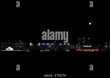 Full moon beach view towards Star Attraction, Sea Life Centre, Funland Amusements, Central Promenade, Blackpool Illuminations Stock Photo